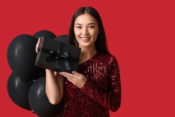 Beautiful Young Asian Woman Gift Box Balloons Red Background Black — Stock Photo, Image