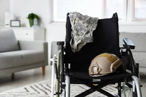 Wheelchair with military helmet in psychologist\'s office