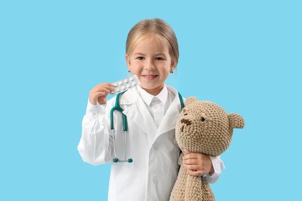 Cute Little Doctor Girl Pills Teddy Bear Blue Background — Stock Photo, Image