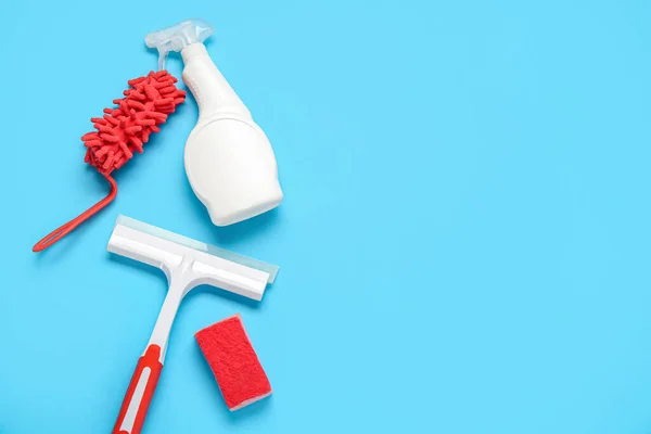 Cleaning products on blue background