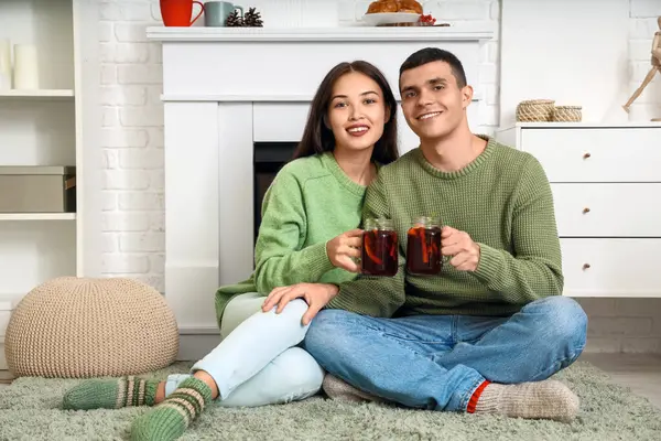 Happy Couple Glasses Warm Mulled Wine Sitting Floor Living Room — Stock Photo, Image