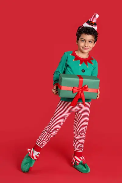 Cute Little Boy Elf Costume Gift Box Red Background — Stock Photo, Image