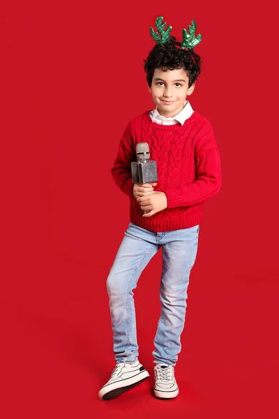 Cute Little Boy Christmas Deer Horns Microphone Red Background — Stock Photo, Image