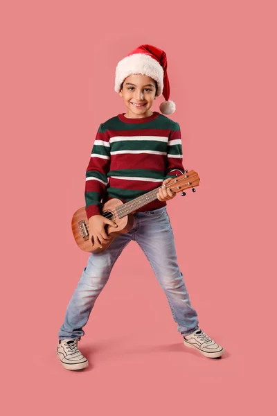 Cute Little Boy Santa Hat Playing Guitar Pink Background — Stock Photo, Image