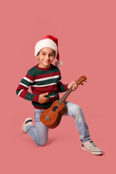 Cute Little Boy Santa Hat Playing Guitar Pink Background — Stock Photo, Image