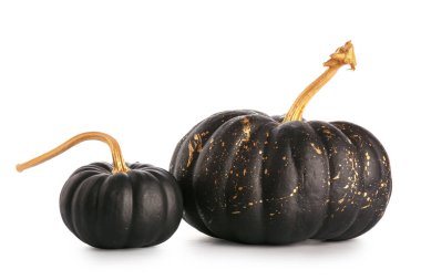 Beyaz arkaplanda siyah boyalı balkabakları