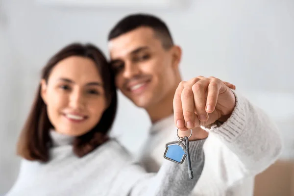 Stock image Happy young couple with key in their new flat, closeup