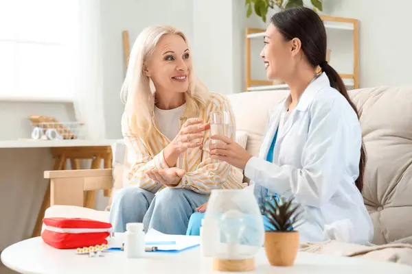 Mature Woman Taking Glass Water Doctor Home — Stock Photo, Image