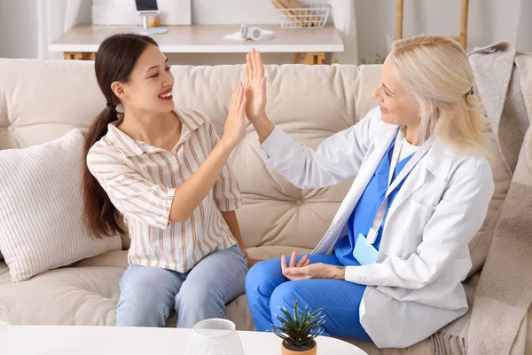 Young Asian Woman Doctor Giving Each Other High Five Home — Stock Photo, Image