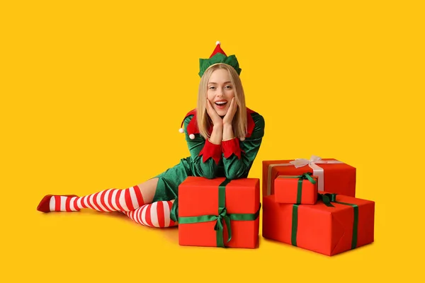 Emotional Young Woman Elf Costume Christmas Gift Boxes Yellow Background — Stock Photo, Image