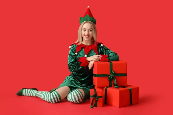 Happy Young Woman Elf Costume Christmas Gift Boxes Red Background — Stock Photo, Image