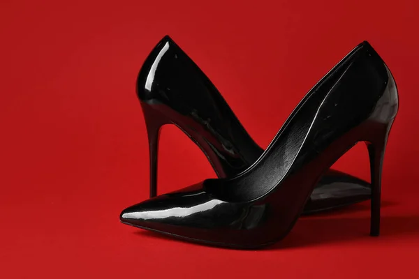 Stylish Black High Heels Red Background Stock Image