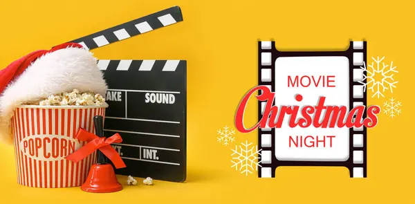 Christmas banner with bucket of popcorn, movie clapper, Santa hat and jingle bell on yellow background