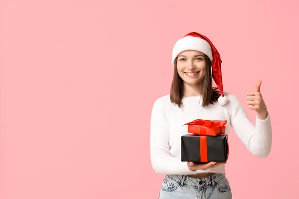 Beautiful Young Woman Santa Hat Gift Boxes Showing Thumb Pink — Stock Photo, Image