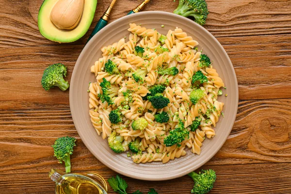 Plate Tasty Pasta Broccoli Wooden Background — Stock Photo, Image