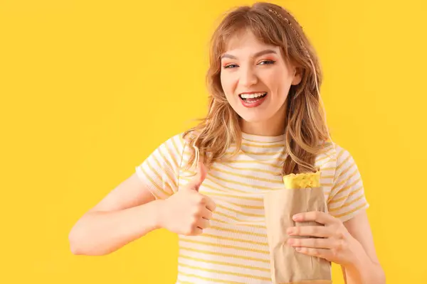 Young Woman Tasty Sandwich Wrap Showing Thumb Yellow Background — Stock Photo, Image