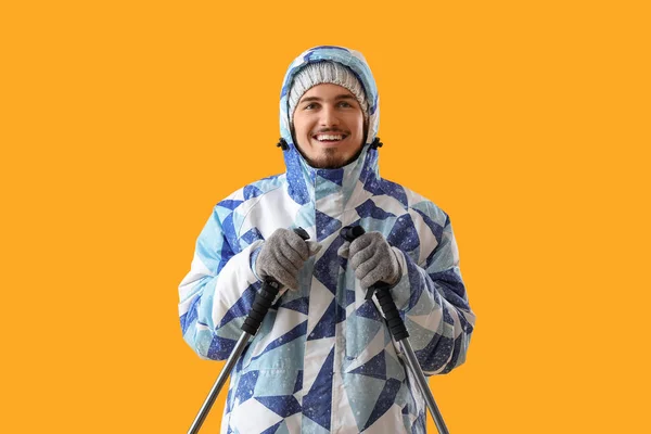 Young Man Winter Clothes Ski Sticks Yellow Background — Stock Photo, Image