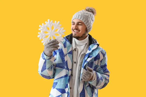 Young Man Winter Clothes Snowflake Yellow Background — Stock Photo, Image
