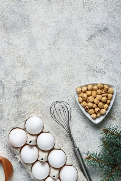 Different ingredients for preparing Christmas pie on grey background