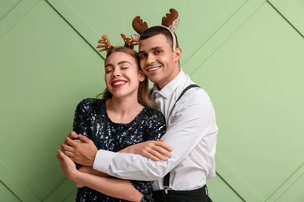 Happy Young Couple Reindeer Horns Green Background — Stock Photo, Image