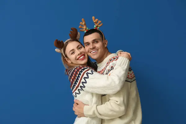 Happy Young Couple Reindeer Horns Blue Background — Stock Photo, Image