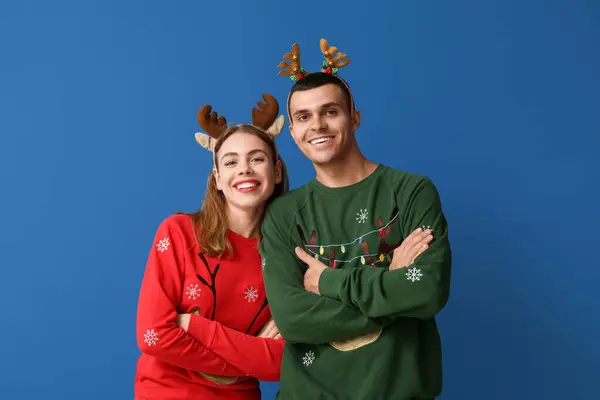 Beautiful Young Couple Reindeer Horns Blue Background — Stock Photo, Image