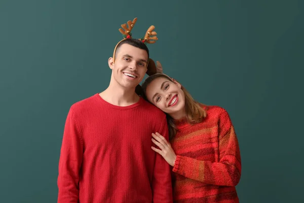 Young Couple Reindeer Horns Green Background — Stock Photo, Image