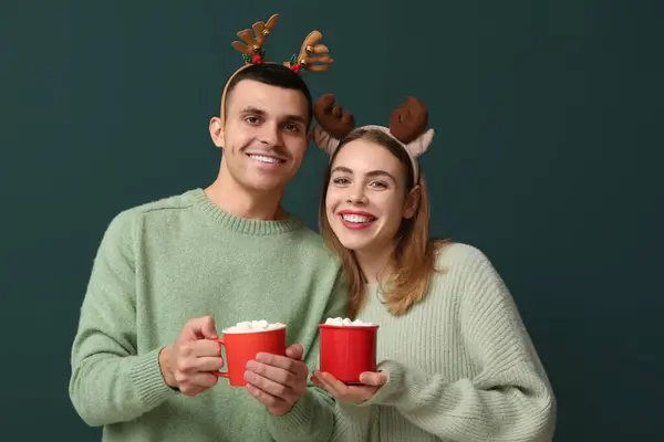 Beautiful Young Couple Reindeer Horns Holding Cups Coffee Marshmallows Green — Stock Photo, Image