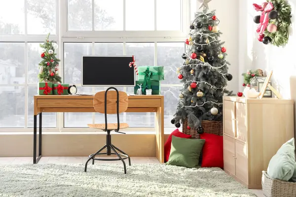 Interior of office with workplace and Christmas trees