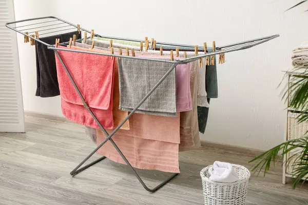 Clean towels hanging on dryer in laundry room