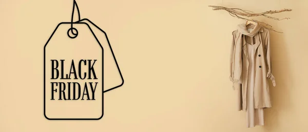 Stylish Coat Text Black Friday Beige Background — Stock Photo, Image