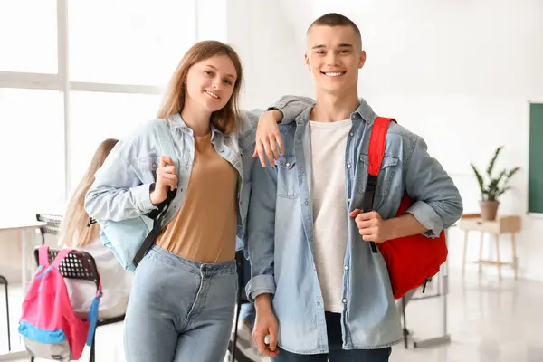 stock image Happy students with backpacks in classroom