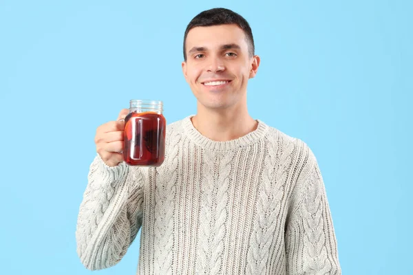 Handsome Young Man Glass Warm Mulled Wine Blue Background — Stock Photo, Image