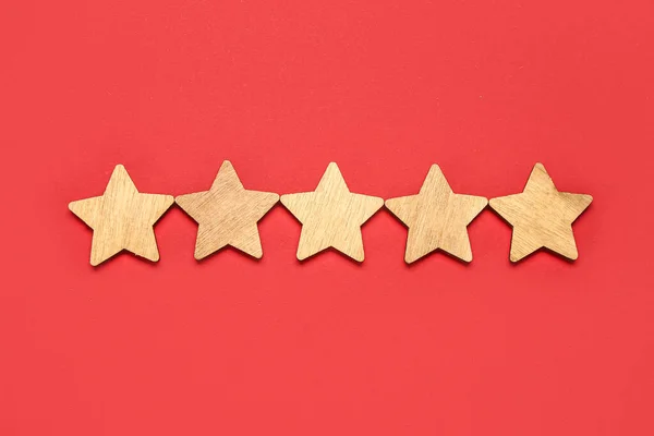 Five stars rating on red background. Customer experience concept