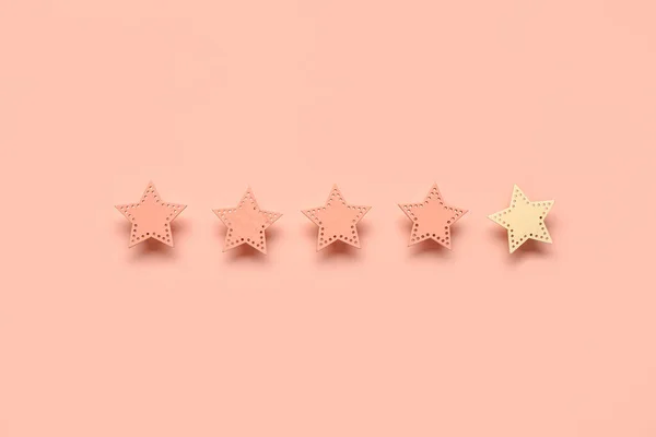 Five stars rating on pink background. Customer experience concept
