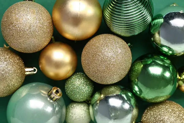Different Christmas Balls Green Background Stock Picture