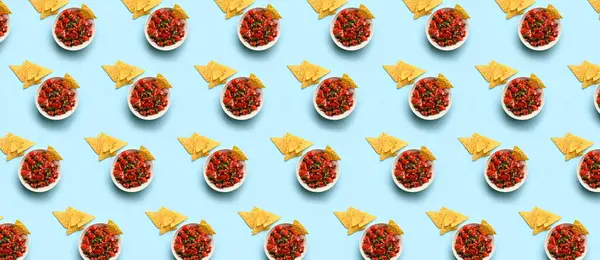 Pattern for design with tasty salsa sauce and nachos on light blue background