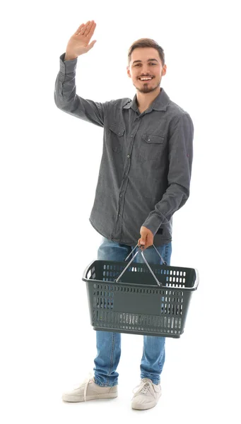 Νεαρός Άνδρας Καλάθι Αγορών Κουνώντας Χέρι Λευκό Φόντο — Φωτογραφία Αρχείου