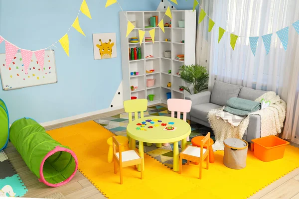 Interior of playroom in kindergarten with toys