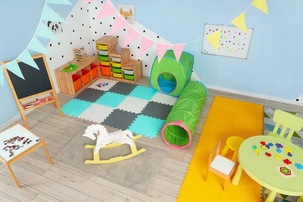 Interior of playroom in kindergarten with toys