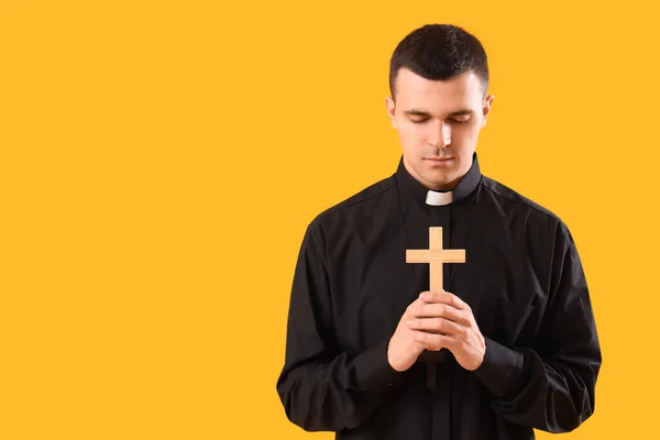 Young Priest Cross Yellow Background — Stock Photo, Image