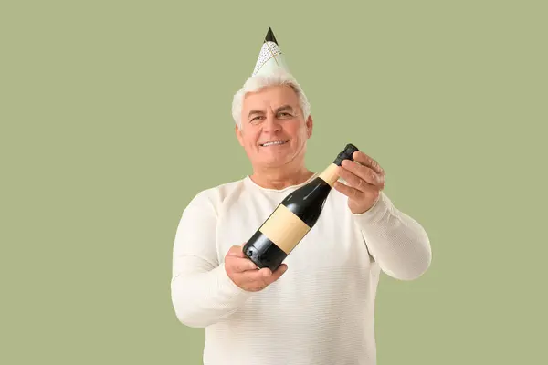 Senior Man Party Hat Bottle Champagne Celebrating Christmas Green Background Royalty Free Stock Images