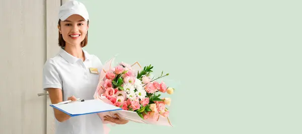 Female courier with bouquet of flowers in hall. Banner for design
