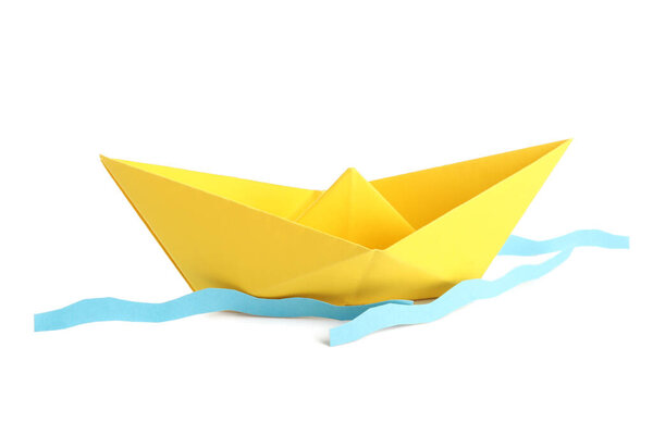 Yellow origami boat and waves on white background