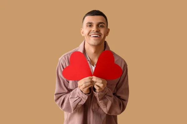 Happy Young Man Red Paper Hearts Brown Background — Stock Photo, Image