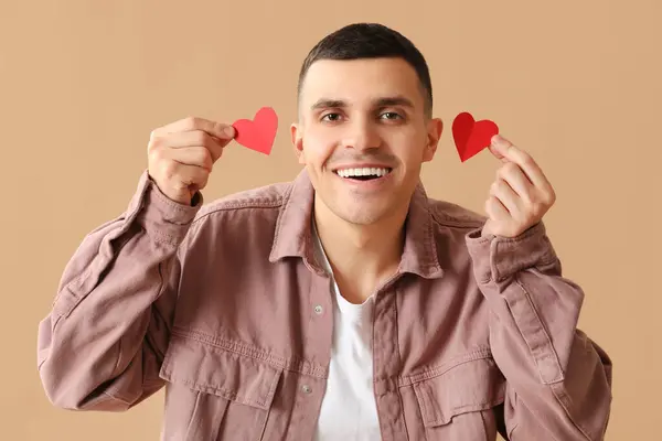 Happy Young Man Red Paper Hearts Brown Background — Stock Photo, Image