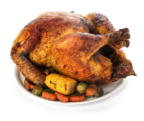 Plate with tasty roasted turkey and different vegetables for Thanksgiving day on white background