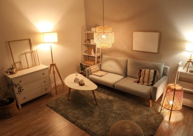 Gri kanepesi, sehpası ve gece lambasıyla modern oturma odasının içinde.