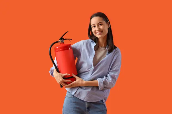 Young Woman Fire Extinguisher Orange Background — Stock Photo, Image