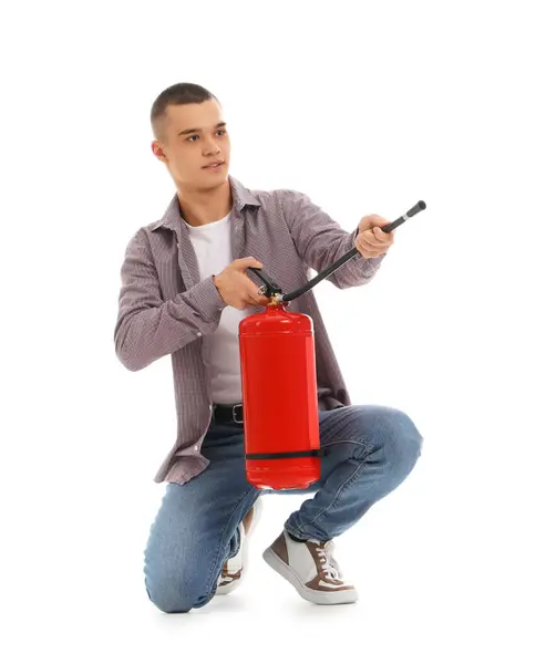 stock image Teenage boy with fire extinguisher on white background